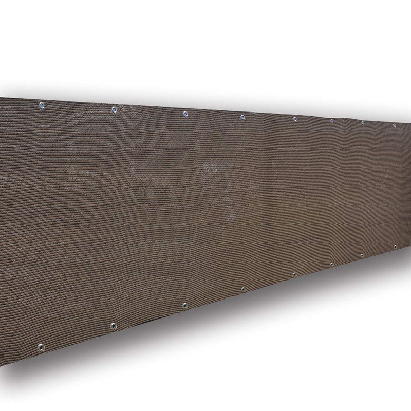 Brown privacy screen mesh with grommets laid out on a white background