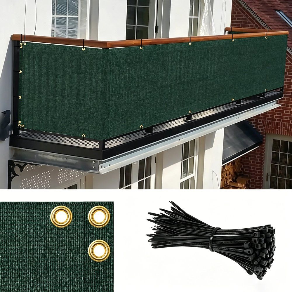 Green privacy fence screen corner showing copper grommets and zip ties