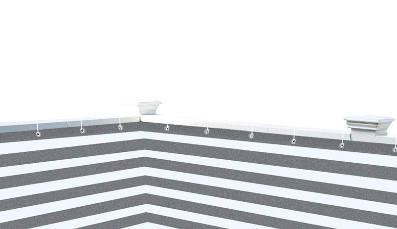 Grey striped HDPE shade net fitted along a fence with metal grommets