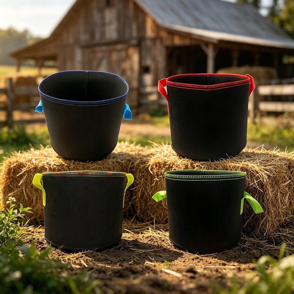 grow bags shown in a range of colours in front of a timber barn