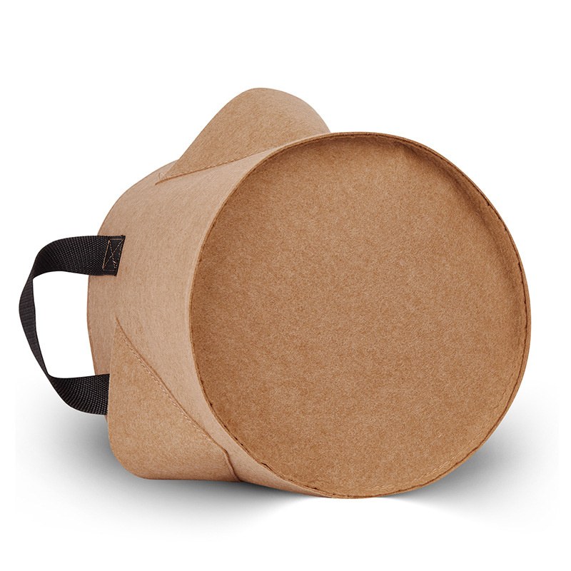 tan needle punched grow bag tipped to show the side pocket construction