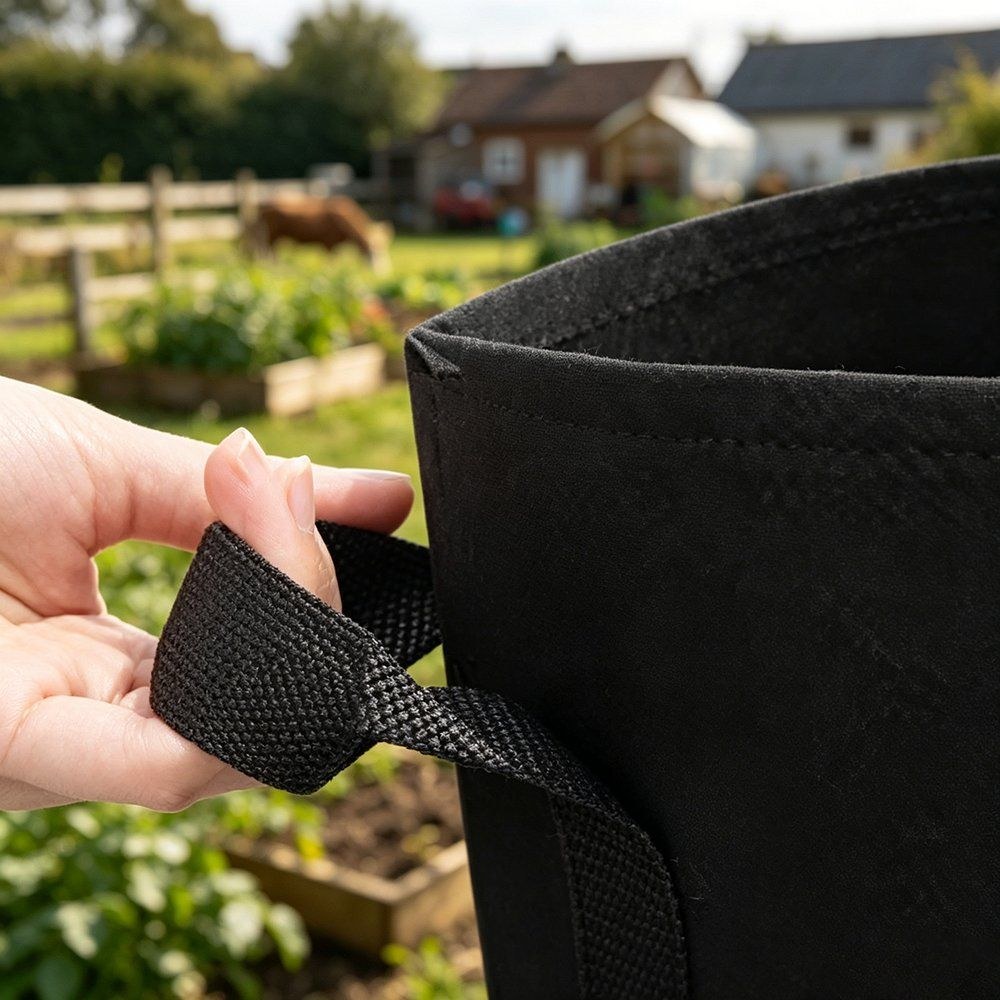close up of a fold-over handle patch stitched into a grow bag wall